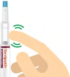 A hand presses a finger on a white Yorvipath medical device with green icons indicating the