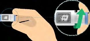 A hand holds a white medical device with a green arrow pointing toward the