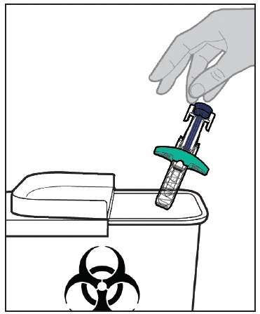 A hand holds a syringe with a green base and transparent body to insert it into a white container with a biological hazard symbol