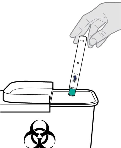 A hand holds a white medical device and presses it against the edge of a biohazard waste container with a biological hazard symbol