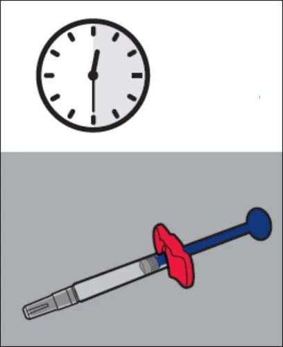 Analog clock indicating 12 o'clock and a syringe-shaped medical device with a red grip and blue and gray body