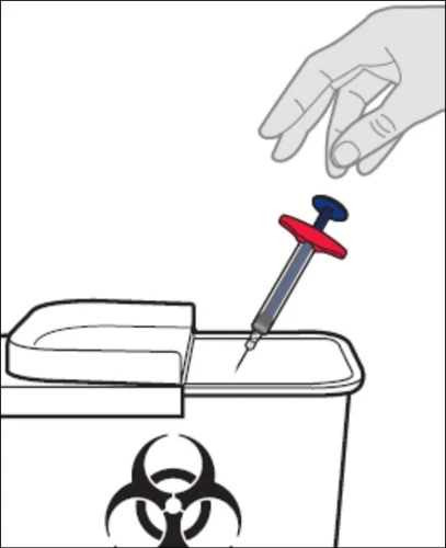 A hand holds a syringe with a red and blue cap to insert it into a white container with a biological hazard symbol