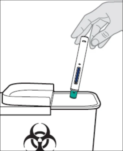A hand holds a pen-shaped medical device to insert it into a disposal container for biohazard waste with a biological hazard symbol