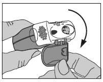 Gloved hands holding a syringe, one hand stabilizing the device while the other moves the safety shield in the direction of the arrow
