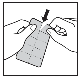 Two hands holding a rectangular sheet with dashed lines, a black arrow indicating the point of tearing the material from the top