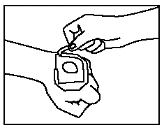 A hand removing the protective needle cap from a sterile medical device held above the patient's skin