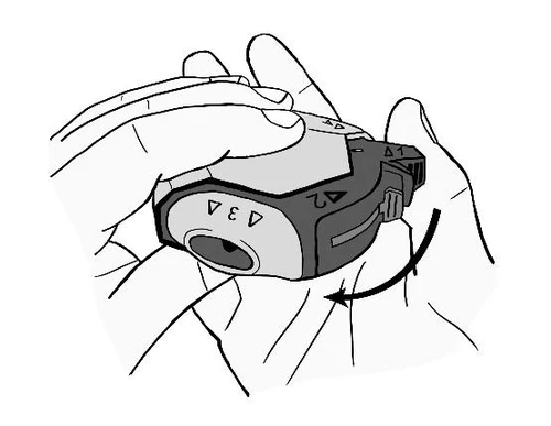 Two hands holding and rotating a medical device according to a black arrow indicating downward and leftward movement