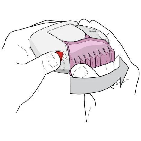 Two hands holding a white-pink medical device, rotating it according to a wide gray arrow indicating motion to the right