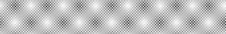 Gray pattern composed of repeating bright, blurred dots on a darker background forming a regular, dotted mesh structure