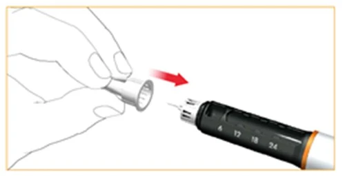 Hand holding a white component being attached to a black injector with a millimeter scale, indicated by a red directional arrow