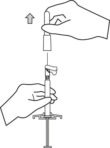 Two hands operating a medical device; one hand holds and lifts the upper part upward following an arrow, while the other stabilizes the base