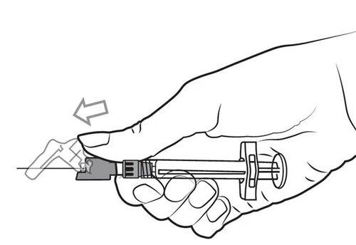 Hand holding a syringe with a needle, the thumb sliding the safety guard towards the needle tip in the direction indicated by the arrow