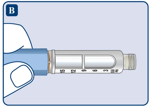 Close-up of a transparent syringe with a milligram scale from 0.6 to 15 mg and a blue handle section on a light background
