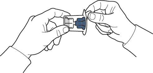 Two hands holding and separating a plastic package containing a blue medical component to retrieve the medication