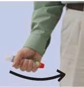 A hand in a green sleeve holding an injection device, with a black arrow indicating a downward rotational movement of the device