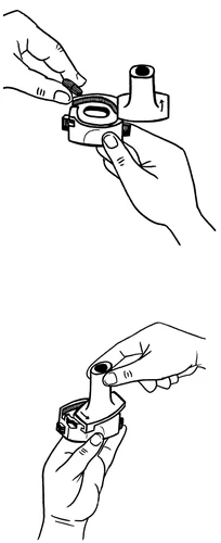Two pairs of hands operating on a medical device, one hand rotating the upper part of the housing while the other holds the base of the device