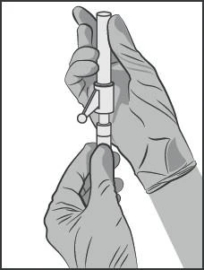 Two hands wearing gloves holding a syringe with a valve vertically, preparing the device for medication administration for medical purposes