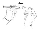 Two hands bringing the syringe and cap closer together, indicated by a black arrow suggesting leftward movement to connect the components
