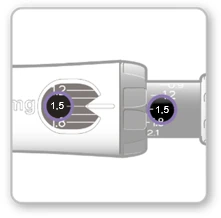 Close-up of a white medical device showing visible scale divisions and black windows indicating a dose value of 1.5 mg