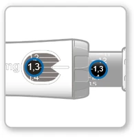 Close-up of the control windows of the medical device showing visible numbers 1.3 and indicators set to the same dose value