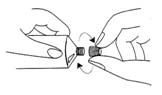 Two hands holding the ends of two components being twisted relative to each other in the direction indicated by the arrows