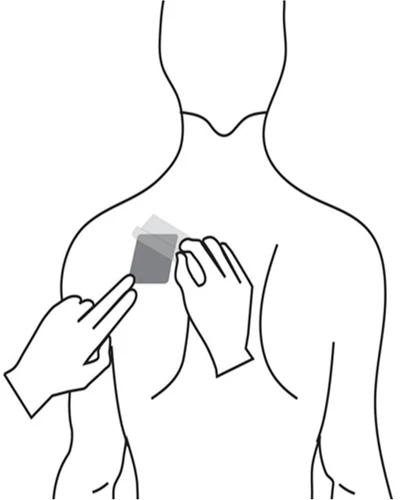 Illustration showing gloved hands applying a small rectangular patch to the upper chest area of a male silhouette