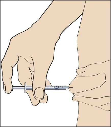Left hand holding a syringe with needle being administered into the thigh, while the right hand stabilizes the skin at the injection site
