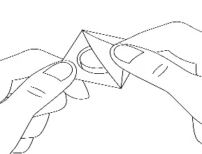Two hands holding and carefully opening a triangular medical package element to retrieve its contents