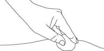 Line drawing showing a hand holding a small, round tablet above a line representing the skin surface or a plane
