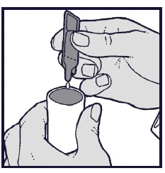 Hands holding a small bottle and a dropper, with a single drop of medication falling directly into the opening of the container