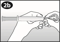 Two hands holding and bending the flexible end of a medical device into a U-shape, forming a loop using fingers
