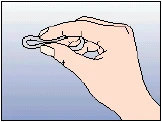 Right hand holding and rotating a small, round medical item between fingers against a light blue background