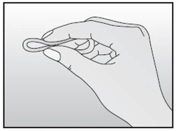 Human hand holding a thin, arc-shaped, flexible medical device between fingers against a light, uniform background