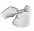 A hand with an extended index finger touching the nose of a person in profile, demonstrating the method of applying medication inside the nostril