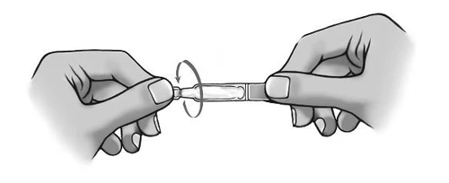 Two hands holding a medication ampoule, one hand grasping the upper part and the other the lower part, with an arrow indicating a twisting motion to open it