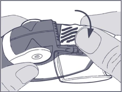 Hands holding a medical device, thumb performing a rotational movement indicated by a black arrow on the housing of a button or knob
