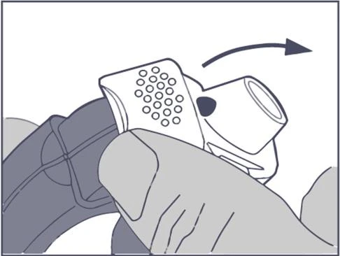 Hand holding a white applicator with a perforated tip, rotating it clockwise over a dark body surface as indicated by a directional arrow