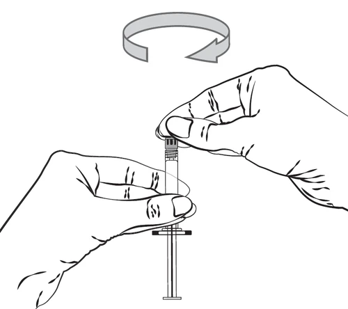 Two hands holding a syringe with a cap, above which a curved arrow indicates rotational movement used to unscrew the component