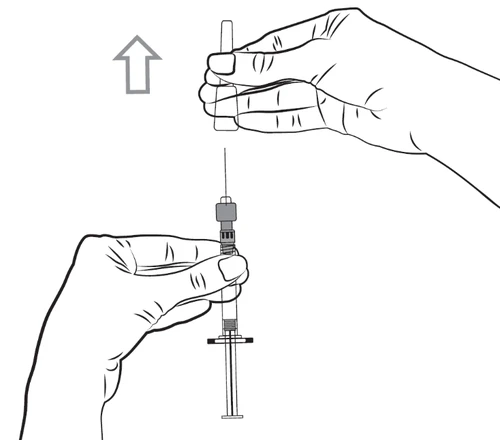 Hand holding the upper part of the syringe and firmly pulling it upward to detach the needle from the lower part of the device