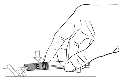 Hand holding a syringe and attaching a needle to it, indicated by a downward-pointing arrow directed toward the needle hub