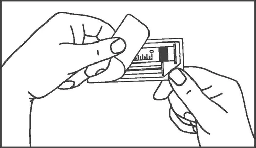 Two hands holding and preparing a rectangular medication in packaging, one hand grasping the upper part and the other the lower edge of the item