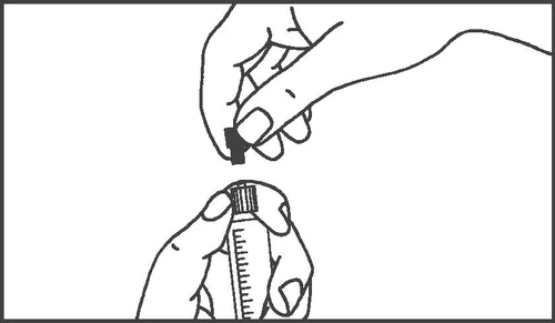 Hands holding a medication vial and a hand removing the black cap from its top to prepare for administration