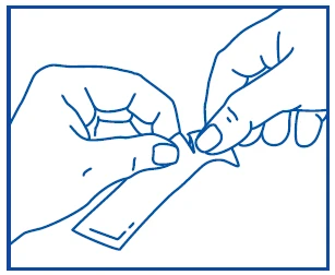Two hands holding and tearing apart a white medication package or sachet into two opposite sides to open the product
