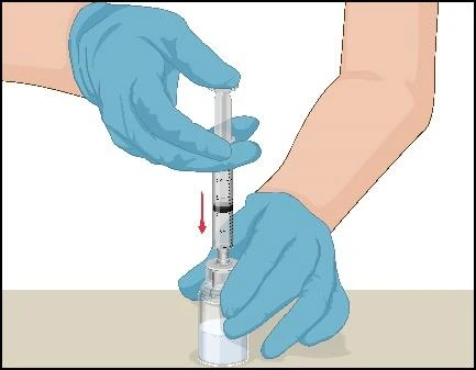 Hands in blue medical gloves holding a syringe filled with liquid, one hand pressing the plunger down, indicated by a red downward-pointing arrow