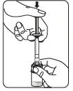 Two hands holding a syringe with needle pressed vertically downward into a glass vial containing medical fluid