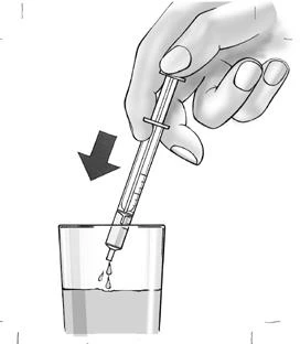 A hand holding a syringe, inserting it at an angle indicated by a black arrow into a glass container with liquid to draw up the medication