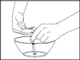 Two hands holding a syringe whose needle is submerged in a transparent bowl filled with liquid on a white background