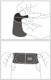 Two hands holding a dark container, one lifting its top part, revealing an open package with a visible gray component inside