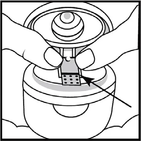 Two hands holding and tilting open the upper part of a medical device, revealing an internal element with perforation and an arrow pointing to an opening