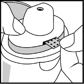 Two hands holding a white container with an opening; one hand lifts a perforated part of the lid, revealing the interior of the device